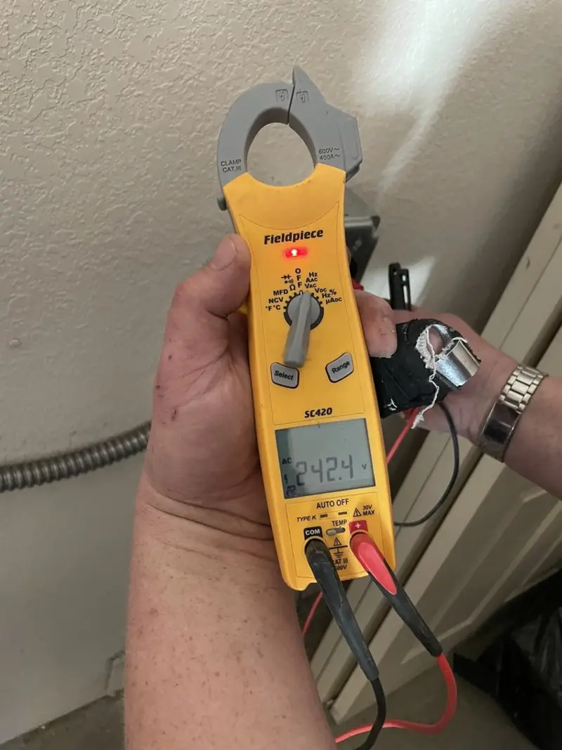 Voltage testing with clamp meter during Electrical Installation Services in Holly Hill